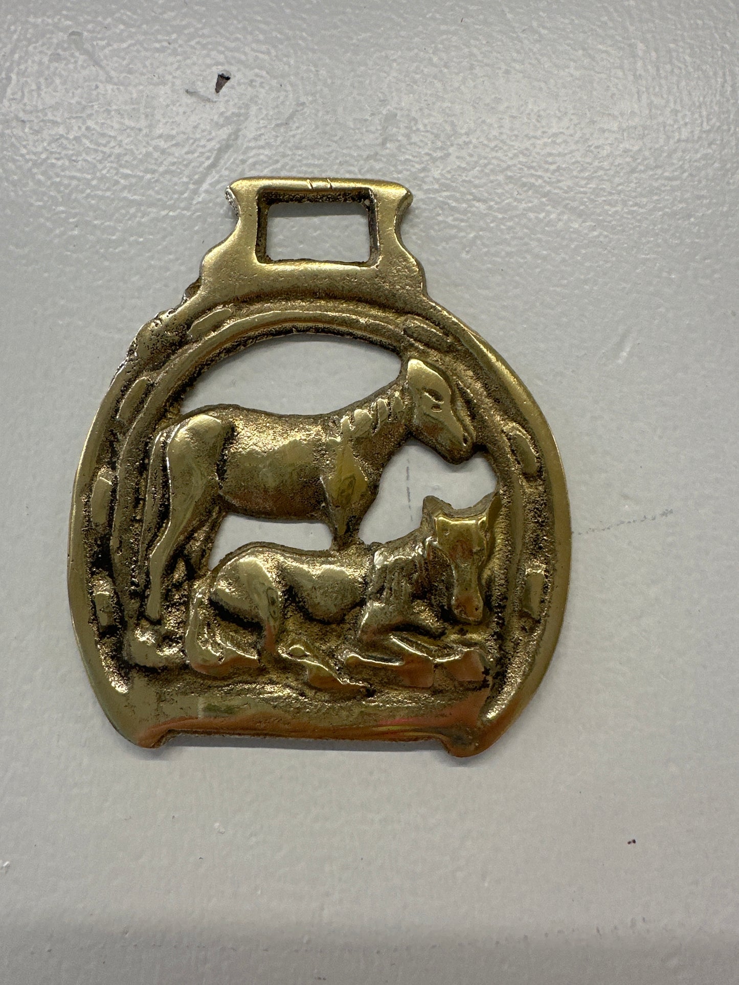 Brass horse medallion